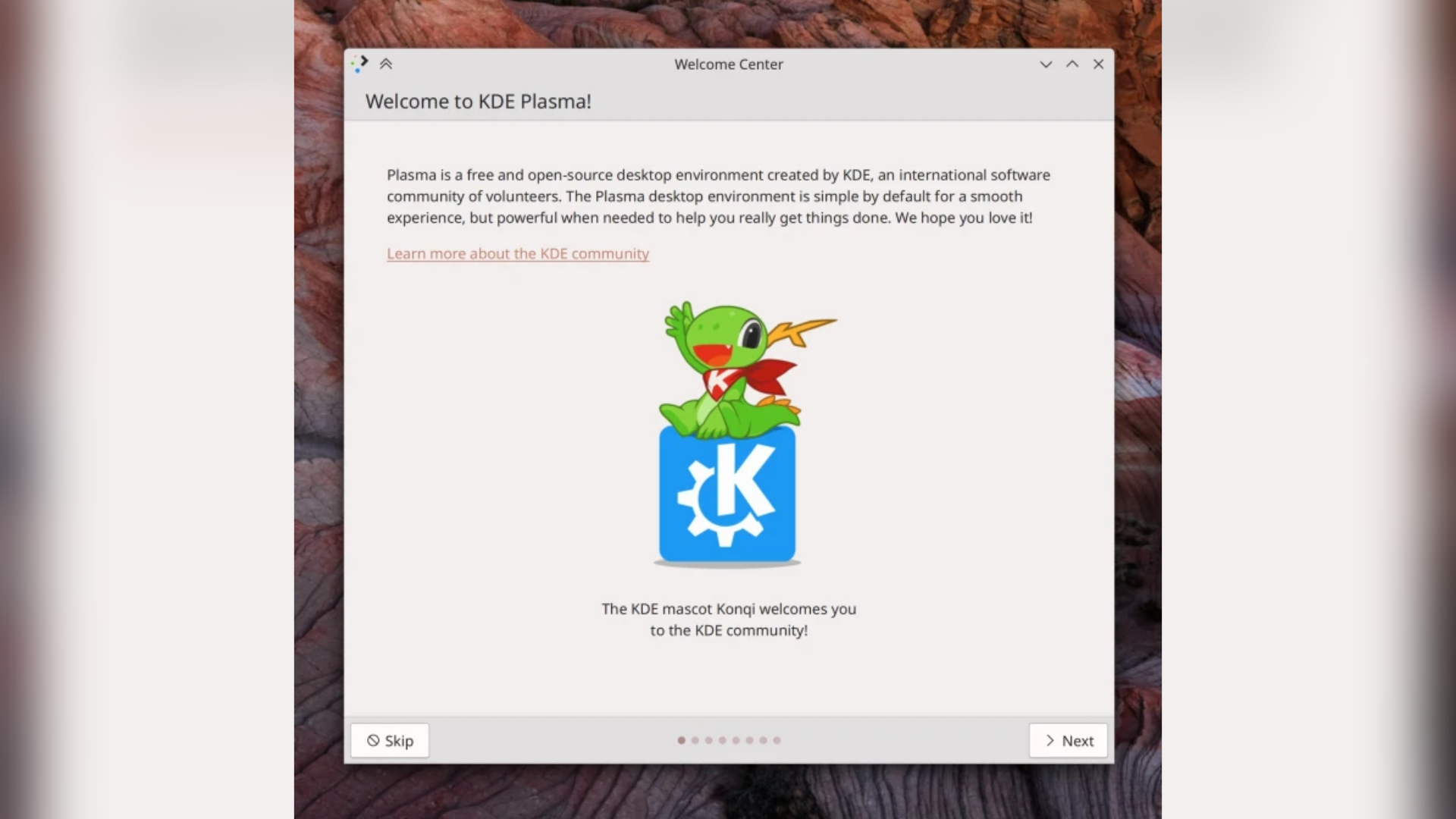 KDE Welcome application, with the header area only containing the text "Welcome to KDE Plasma!" and the footer having "Skip" and "Next" buttons, along with dots to represent the number of pages.